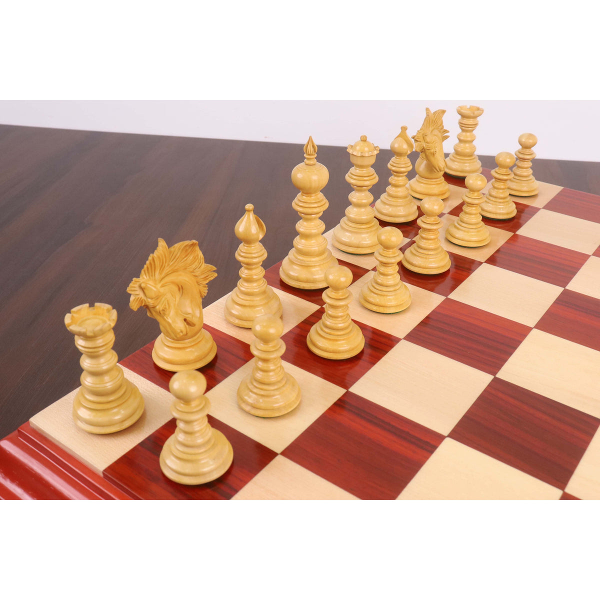 Elegant setup of light boxwood Marengo chess pieces on a wooden board.