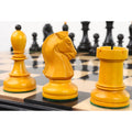 Hand-carved Dubrovnik chess pieces displayed on a wooden chessboard.