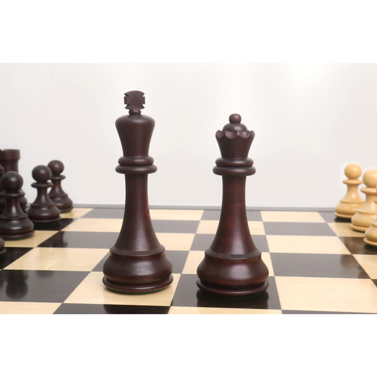 Dark mahogany stained boxwood king and queen, 5-inch king size.