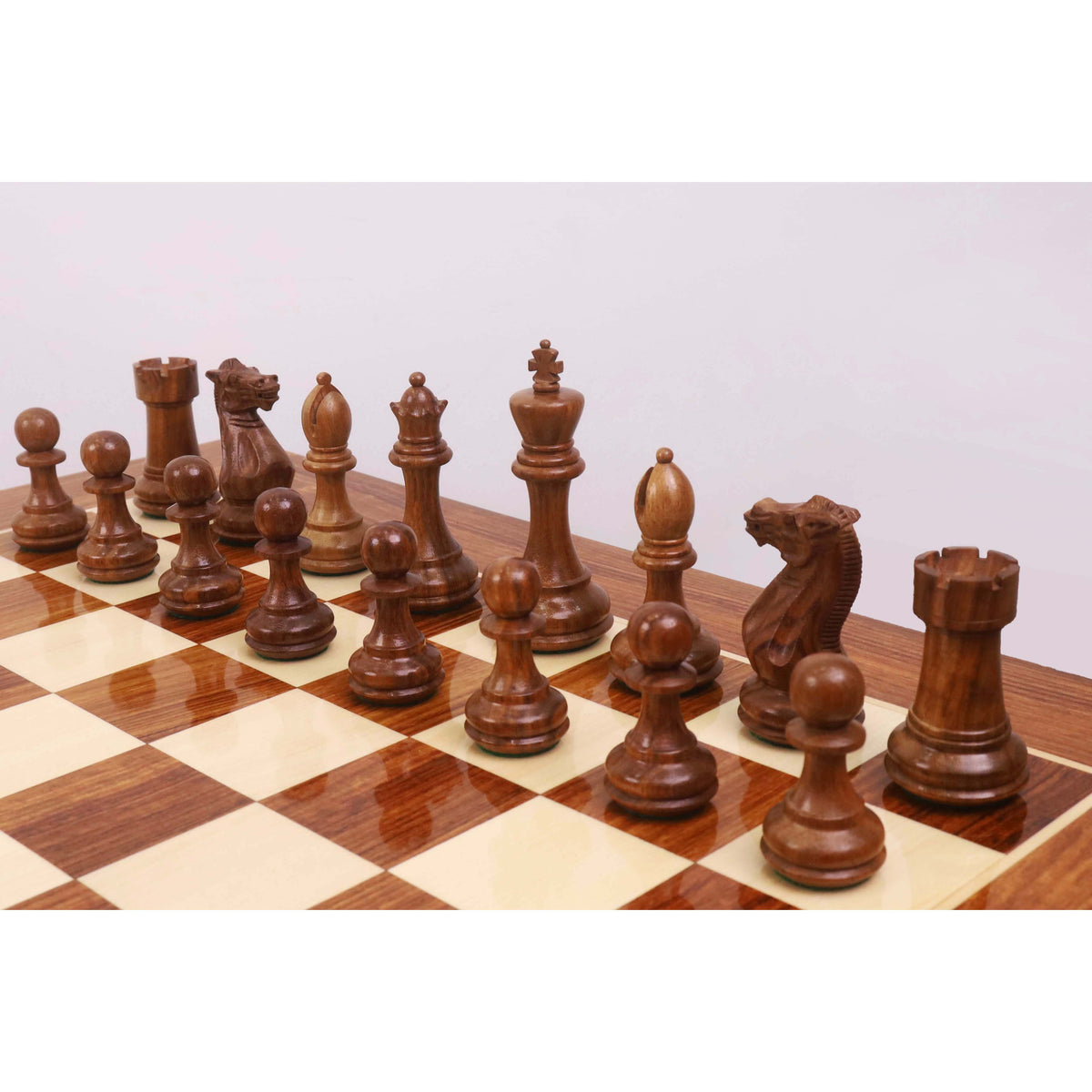 A full rank of Golden Rosewood Pro Staunton weighted chess pieces highlighting the wood grain and craftsmanship.