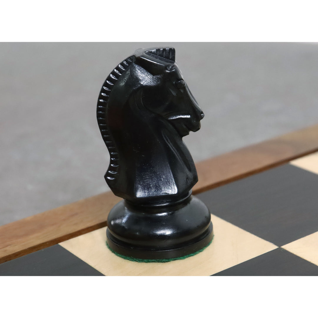 Detailed view of a black ebonised Dubrovnik knight on a chessboard.