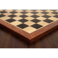 Detailed perspective view of the mitered Golden Rosewood border on a large Ebony and Maple tournament chess board.