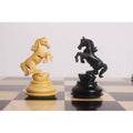 Intricately carved boxwood and ebony wood Knights in a rearing stance from the Incitatus Staunton chess set.
