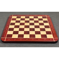Low-angle perspective shot of the 23" professional chessboard showing the 60mm squares and thick solid wood profile.