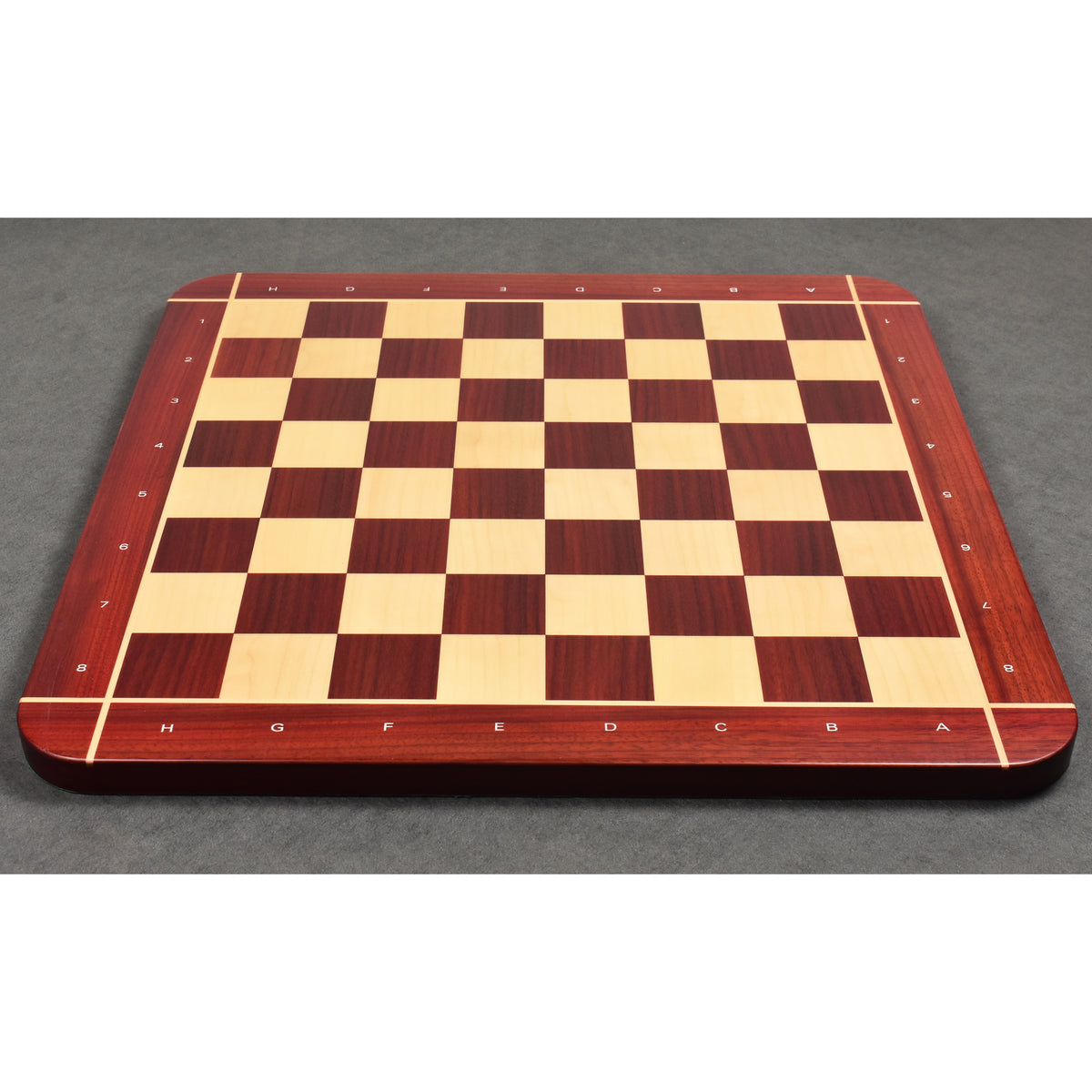 Low-angle perspective shot of the 23" professional chessboard showing the 60mm squares and thick solid wood profile.