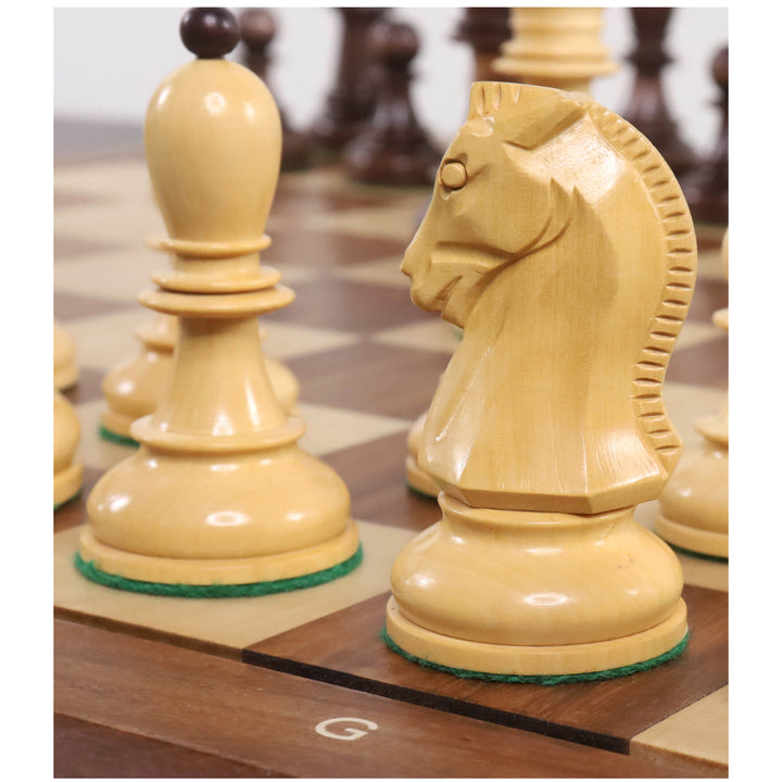 Macro view of a natural boxwood Fischer Dubrovnik knight and bishop on a board.