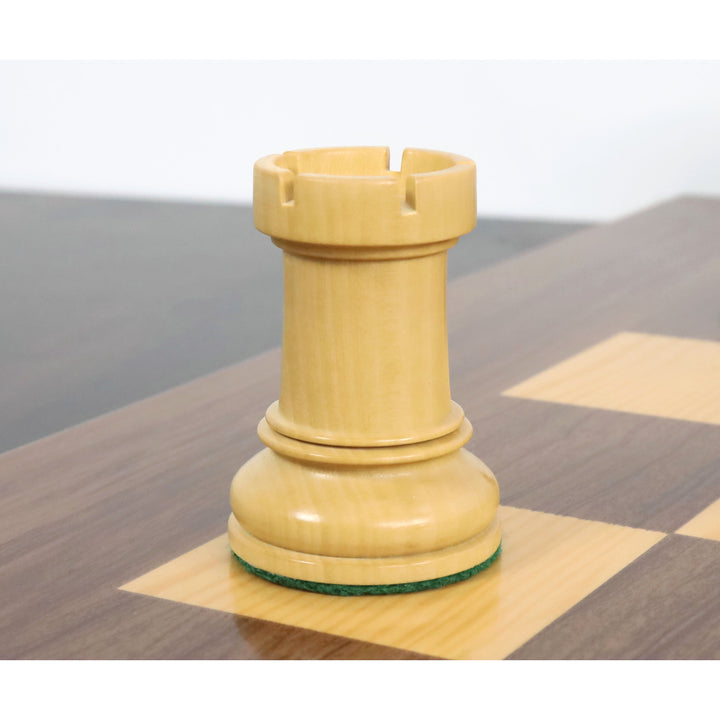 Close-up of a natural boxwood Fischer Dubrovnik rook chess piece on a board.