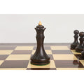 Close-up of the mahogany stained boxwood Queen from the 3.8" Candidates Series Minimalist chess set on a board.