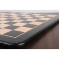 Close-up of the smooth black border and inlaid maple surface of the high-quality tournament chess board.