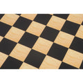 Extreme close-up of the maple and ebony printed squares showing the natural wood grain texture.