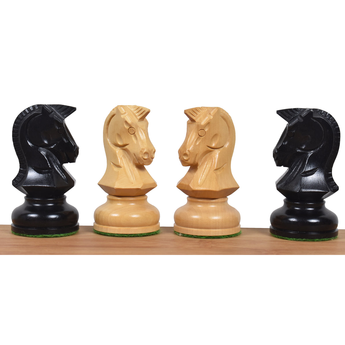 Profile view of four 1970s Dubrovnik knights in alternating ebony and boxwood finishes.