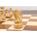 Close-up of a boxwood Staunton knight chess piece showing intricate hand-carved details.