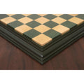 Precise mitered corner of the handcrafted green and maple chess board with tiered molding.