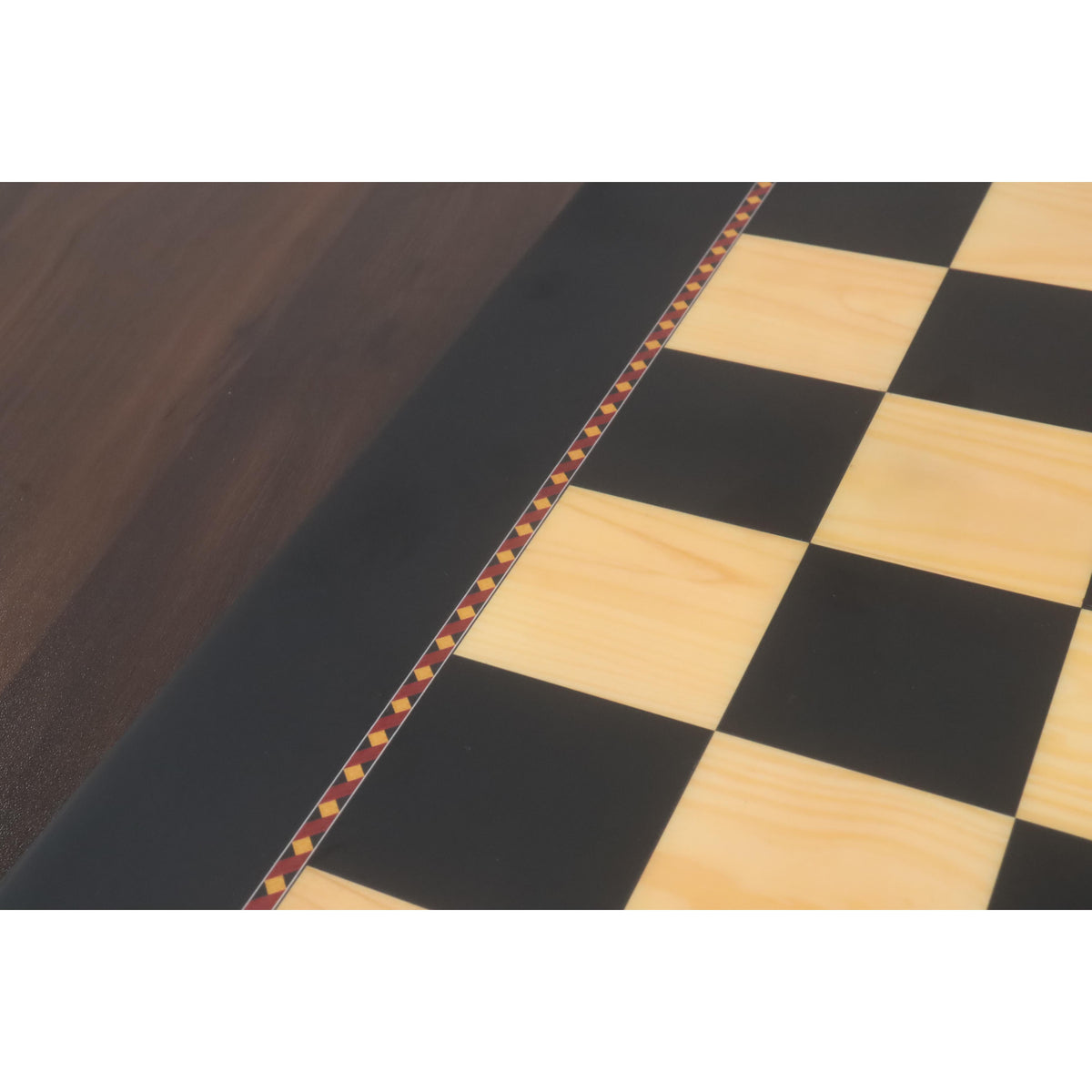 Macro view of the 55mm ebony and maple squares on the Queens Gambit printed chess board.