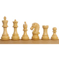 Complete lineup of natural boxwood Craftsman Staunton chess pieces showing detailed hand-carving.
