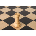 Hand-carved boxwood rook from the Tilted Knight luxury chess collection.