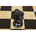 Close-up of hand-carved ebony wood 1849 Jacques Cook Staunton knight chess piece