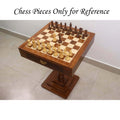 20 inch Monarch series chess table set up with weighted wooden pieces for a match.