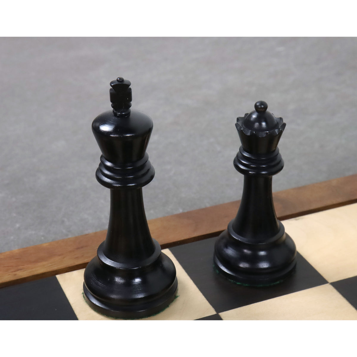 Black ebonised boxwood king and queen pieces from the 4-inch Leningrad Staunton chess set.