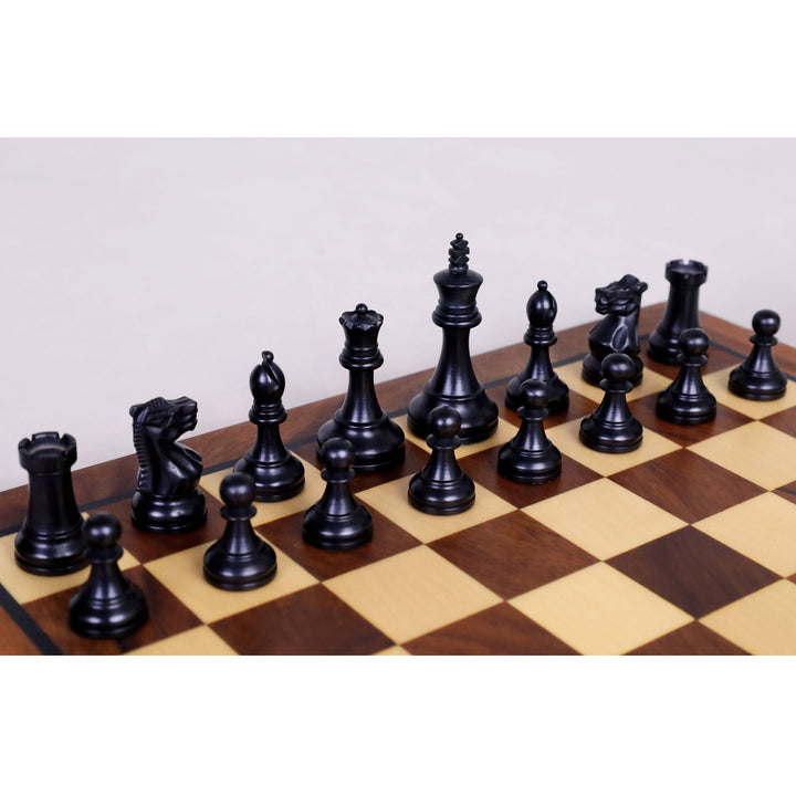 Ebonised boxwood black chess pieces lined up on the wooden magnetic chess board squares.