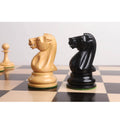 Side profile of boxwood and ebony knights highlighting the artisan craftsmanship and uniform design.
