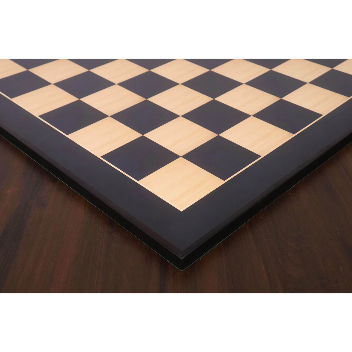 High-contrast corner detail of a 26 inch large ebony and maple wood printed chess board.