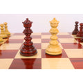 Elegant bud rosewood and boxwood Staunton queen chess pieces.