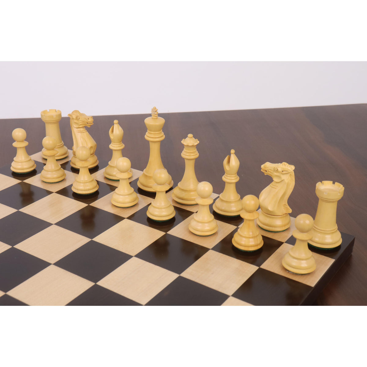 Diagonal view of the white boxwood pieces from the Sleek Staunton luxury chess set.