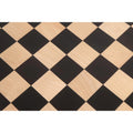 Macro view of the natural wood grain on the ebony and maple squares of the 60mm square chess board.