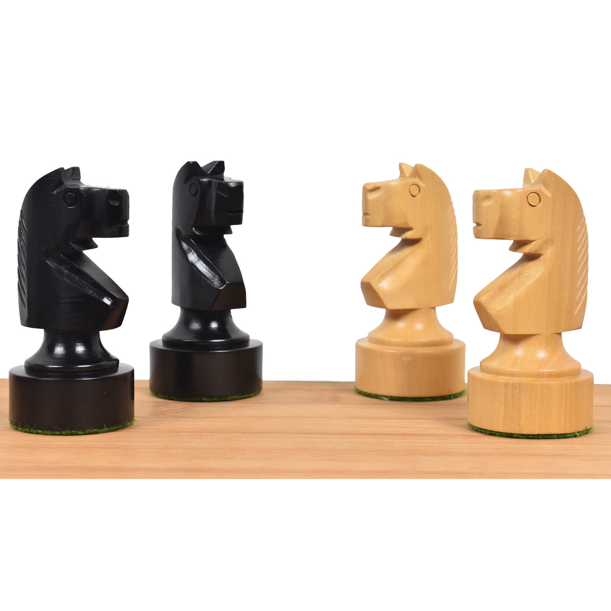 Profile comparison of ebonised and natural boxwood Knights from the Bundesform alternative chess set.