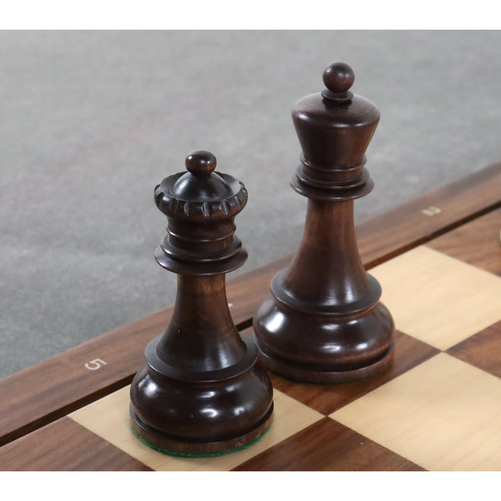 Mahogany stained Fischer Dubrovnik queen and king chess pieces standing on a board.