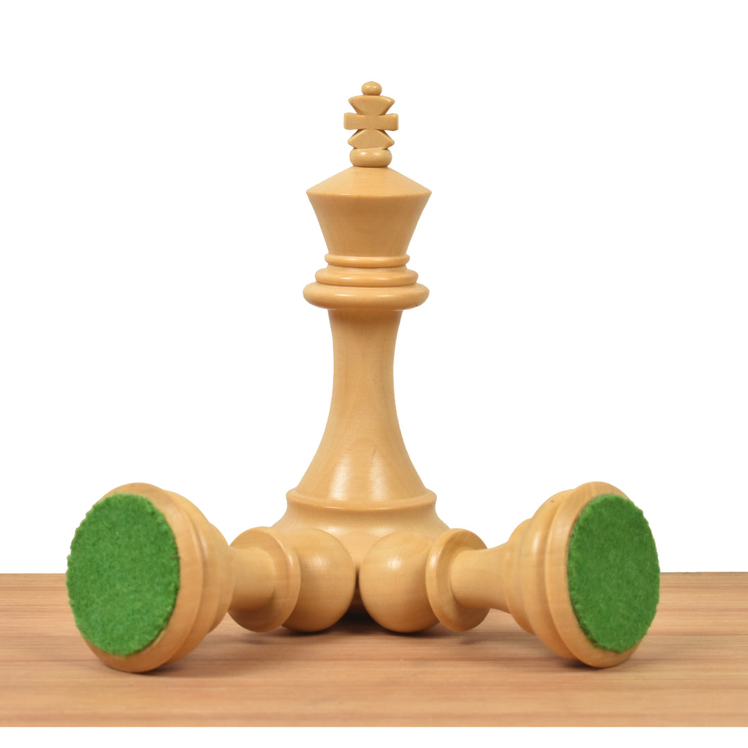 Weighted Staunton chess king piece showing green felt base with fallen pieces.