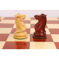 Close-up side profile of 1849 Jacques Cook Staunton chess knight pieces.