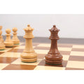 Weighted Staunton queens in boxwood and golden rosewood with traditional crenellated crowns.
