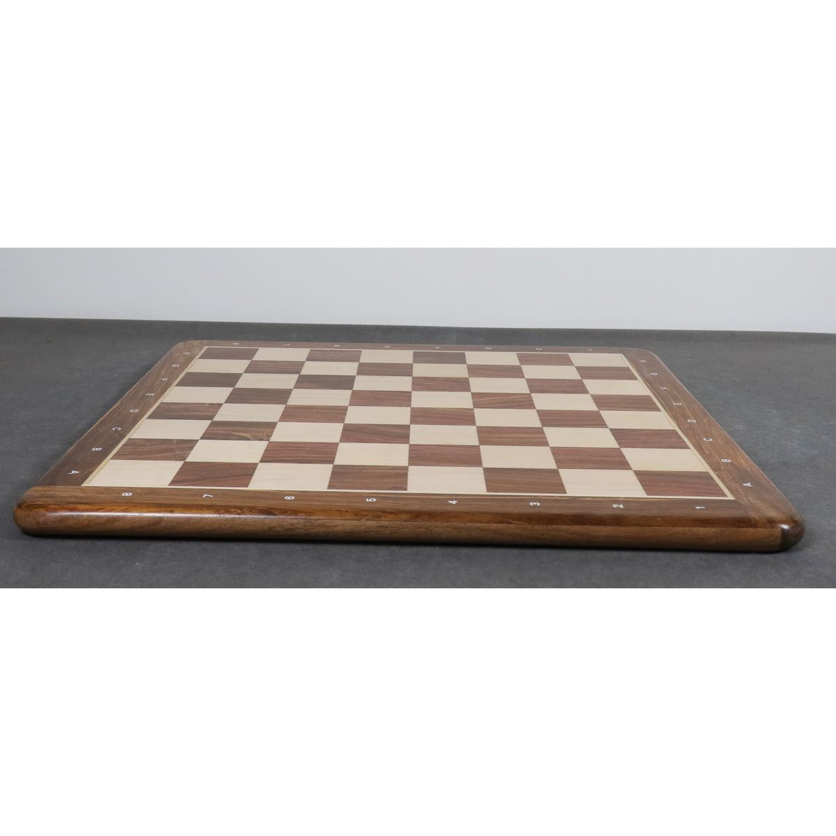 Low-profile side view of the professional 21-inch wooden chess board highlighting its solid wood thickness.