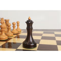 Detailed view of the dark rosewood queen from the 3.8" Candidates Series minimalist chess set on a wooden board.