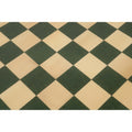 Macro view of the green and maple wood grain squares on a 21 inch HDMR chess board.