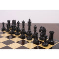 Black ebony Heritage Series Staunton chess pieces arranged on the board during a game.