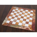 Empty 15-inch handcrafted brown onyx and white stone chessboard featuring a wide, polished marble border.