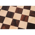 Extreme close-up of the natural wood grain in the Rosewood and Maple 65 mm squares on the large 25-inch tournament-style chess board.