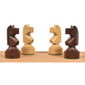 Four Bundesform German Staunton knights in golden rosewood and boxwood showing their profile.