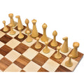 Elevated view focusing on the natural boxwood Herman Ohme chess pieces on a chessboard.