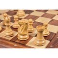 Close-up of Boxwood Knight and Rook on the chessboard.
