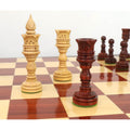 Elegant 4.7" Lotus Series King in Bud Rosewood and Queen in Boxwood on a wooden board.