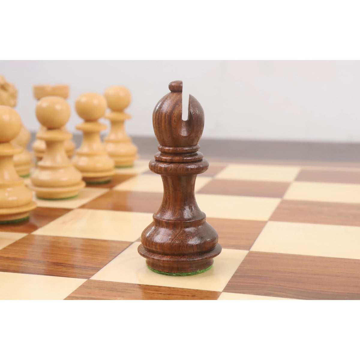 Hand-carved golden rosewood bishop piece from the 3.2 inch weighted Staunton set.