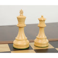 Natural boxwood king and queen pieces from the Reykjavik series standing on a wooden chessboard.