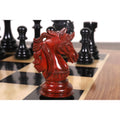 Macro view of a handcrafted bud rosewood knight on a luxury chess board.