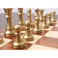 Close-up of matte gold pawns from the Pro Staunton brass metal luxury chess set arranged on a wooden board.