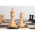 Natural boxwood king and queen from the 4" Fierce Knight Staunton chess set positioned on a chessboard.