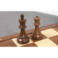 Close-up of the Golden Rosewood King and Queen from the 1972 Championship series showing natural wood grain.
